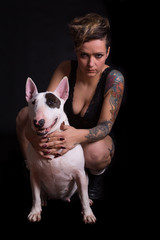 Tattooed Woman and bull terrier