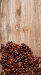 coffee beans and cup on wooden background