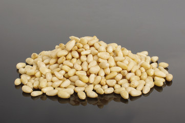 Stack of pine nuts isolated on the dark background