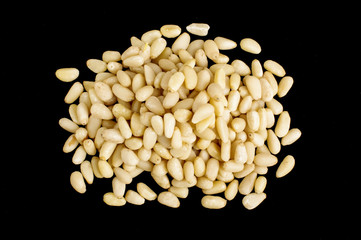Pile of pine nuts isolated on the black background
