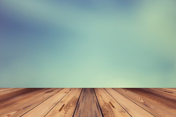 Wood floor and abstract blur background with space for text