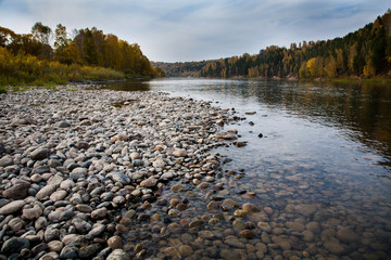 Pure mountain river. Clear water where you can see the stones.