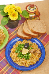 Porridge in a dish seasoned with chives