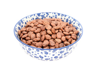 Pinto beans in a blue and white china bowl