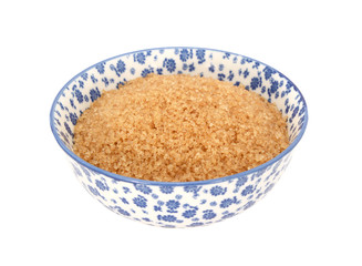 Demerara sugar in a blue and white china bowl