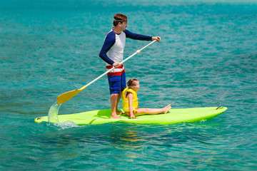 Father and daughter paddling