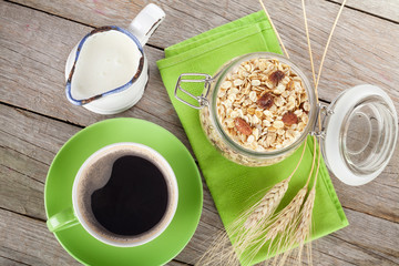 Healthy breakfast with muesli, milk and coffee cup