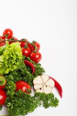 Fresh raw vegetables on a white background.