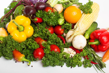 Fresh raw vegetables on a white background.