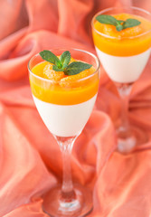 Panna cotta with Mandarin jelly. Shallow depth of field