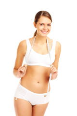 Obraz premium Fit woman with a tape measure
