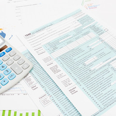 US 1040 Tax Form and calculator - studio shot