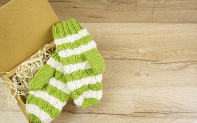 Winter green with white mittens in gift box