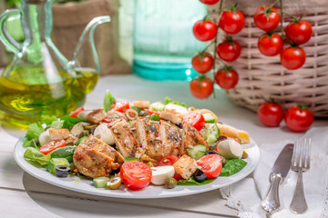 Homemade caesar salad with fresh vegetables
