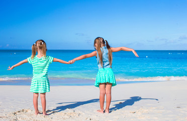 Little adorable girls during tropical summer vacation