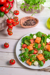 Fresh vegetables and salmon as ingredients for salad