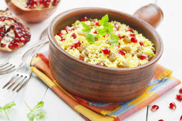 Couscous with pomegranate, raisins and spices