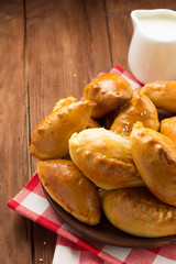 tasty pastry on plate at wood