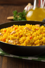 frying pan full of rice on wood