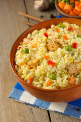 bowl full of rice on wood