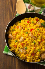 frying pan full of rice on wood