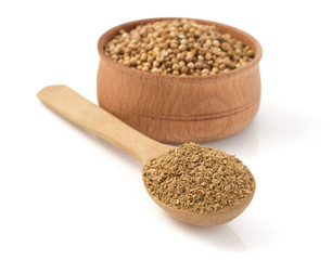 coriander spices in spoon on white