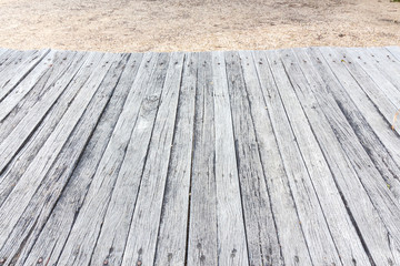 Empty wooden table with blurry sand background