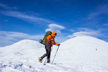 Fototapeta na wymiar Winter hiking in the mountains on snowshoes.