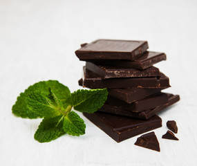 Chocolate pieces with a leaf of mint