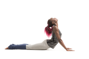 Woman in the Cobra yoga pose - obrazy, fototapety, plakaty