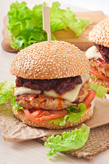 American burger with chicken and bacon, homemade barbecue sauce