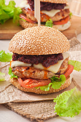 American burger with chicken and bacon, homemade barbecue sauce