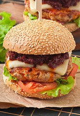 American burger with chicken and bacon, homemade barbecue sauce