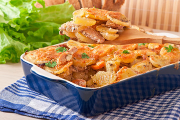 Potato casserole with meat and mushrooms with cheese crust