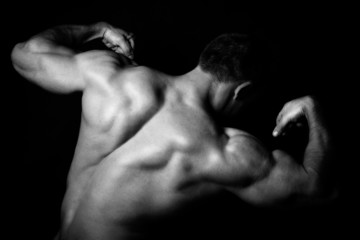 Obraz na płótnie Canvas Rear view of healthy muscular young man