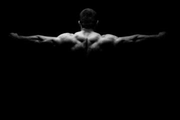 Obraz na płótnie Canvas Rear view of healthy muscular young man