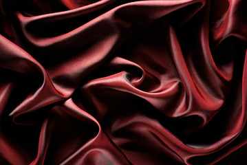 Obraz premium Abstract wave textile texture or background in marsala color