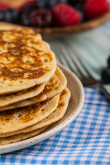 stack of fresh pancakes with fresh fruits