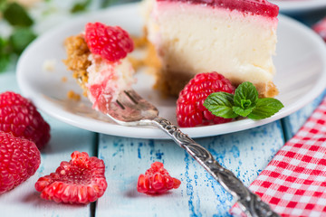 Raspberry cake with fresh fruits on rustic table
