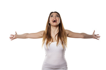 happy young woman with arms open - obrazy, fototapety, plakaty