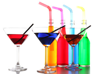 Colorful alcoholic beverages in glassware isolated on white