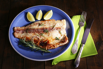 Dish of Pangasius fillet with rosemary and lime
