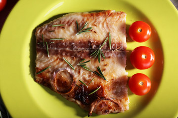 Dish of Pangasius fillet with rosemary and cherry tomatoes in