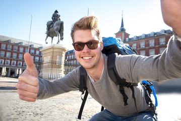 backpacker tourist taking selfie photo mobile phone outdoors