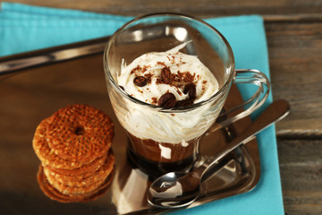 Cup of coffee with cream and cookies