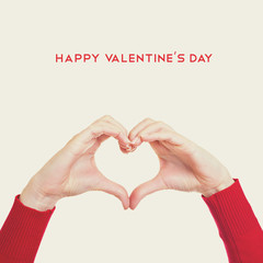 Female hands gesturing heart. Happy Valentine's Day