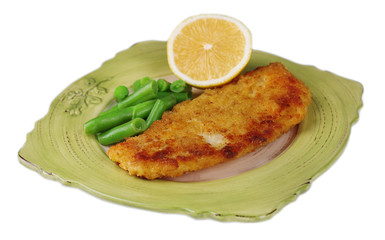 Breaded fried fish fillet and potatoes with asparagus and