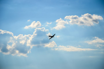 Spitfire in flight on blue cloudy sky over Bratislava