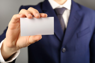 Businessman with business card, close-up