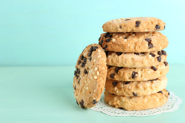 Tasty cookies on color wooden background